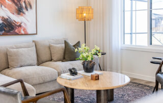 Open-concept living room in the Douglas model by StreetSide Calgary featuring modern finishes, ample natural light, and comfortable gathering space.