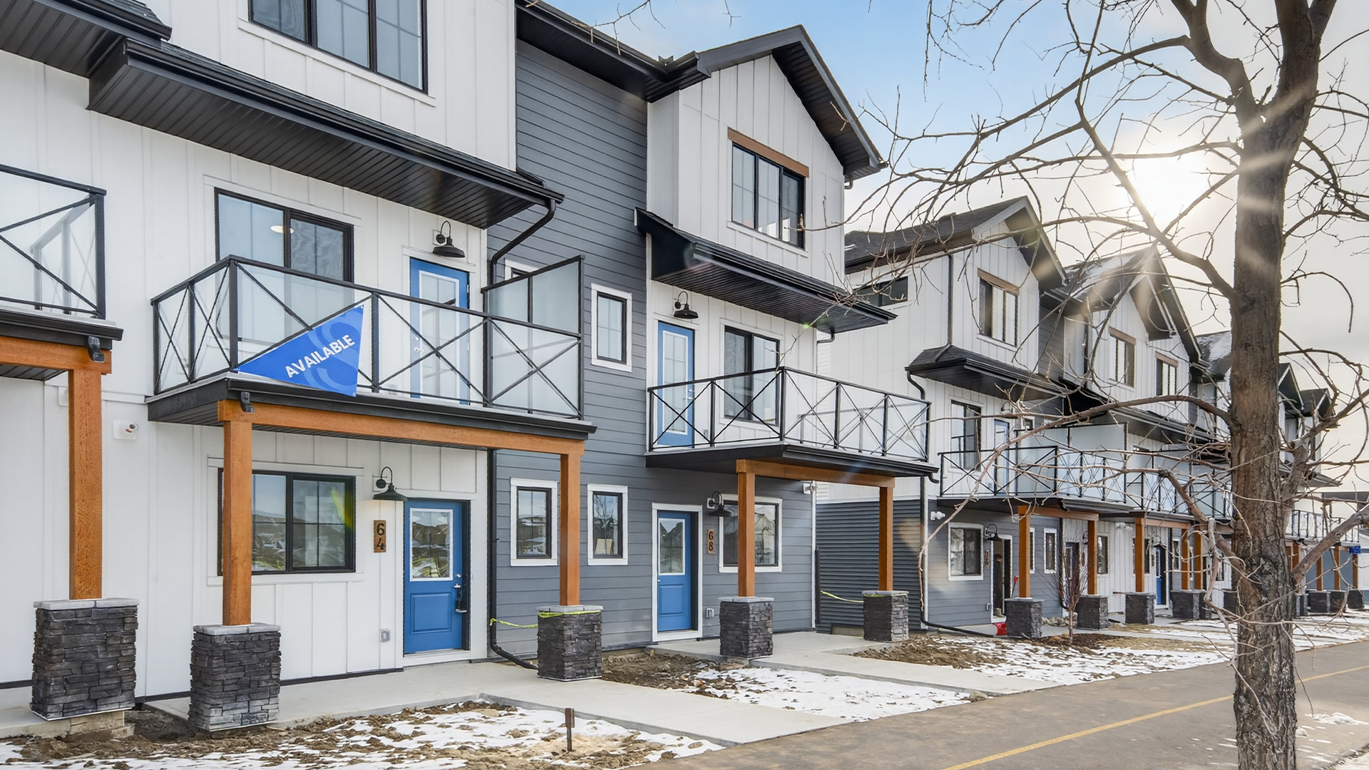 Modern StreetSide Calgary townhomes available for first-time home buyers beginning their homeownership journey.